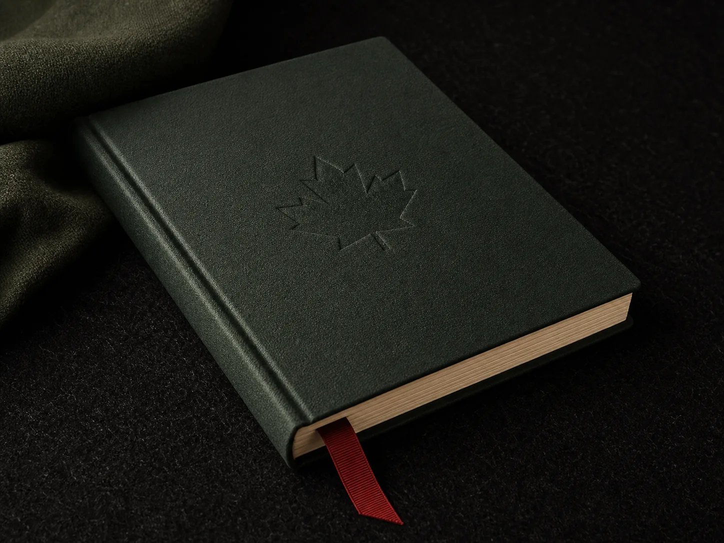 Dark green notebook with a red page marker